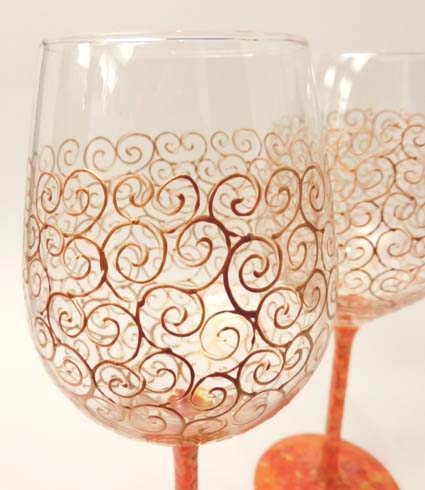 Wijnglas krul goudkleur met oranje/goud voet